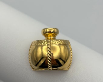 Yves Saint Laurent, pin de solapa vintage de los años 90 con un frasco de perfume chapado en oro