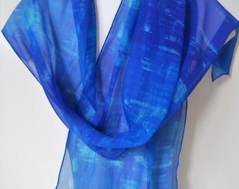 A soft lightweight silk chiffon scarf which has been hand painted in an abstract design in shades of blue and turquoise OOAK Gift for her