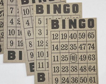May include: A set of four brown paper bingo cards with black text and numbers. The cards are stacked on top of each other and the top card is partially visible. The text on the cards reads "Bingo" and the numbers are arranged in a grid.