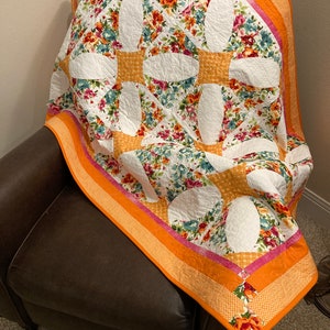 Floral orange/pink/white lap quilt