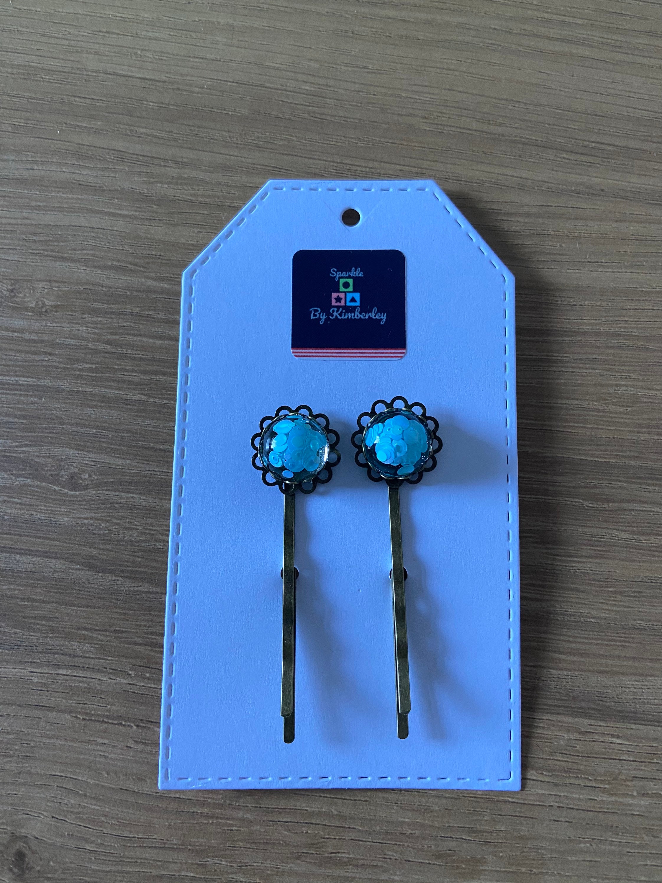 Baby blue sparkle hair grips.