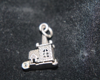 Church Charm opens on bottom reveals couple getting married inside Marked 925 inside (can not get a picture need jewelers loop to see)