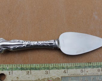 Floral cake server Blade marked stainless handle marked with R sterling 36 grams
