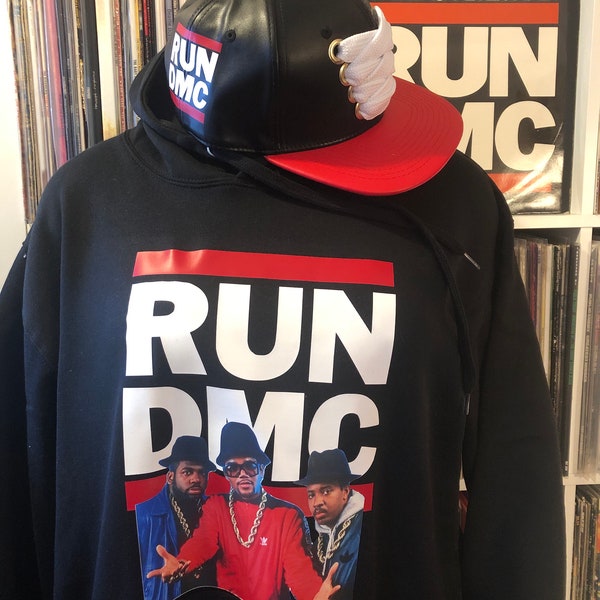 Run DMC 1986. Black hoodie with red and white logo and graphics. 80s hip-hop, old school