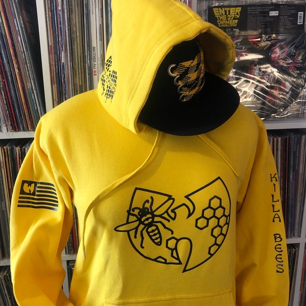 Wu-Tang Killa Bees on a  Swarm. Yellow hoodie with black graphics.  90s hip-hop. 36 Chambers