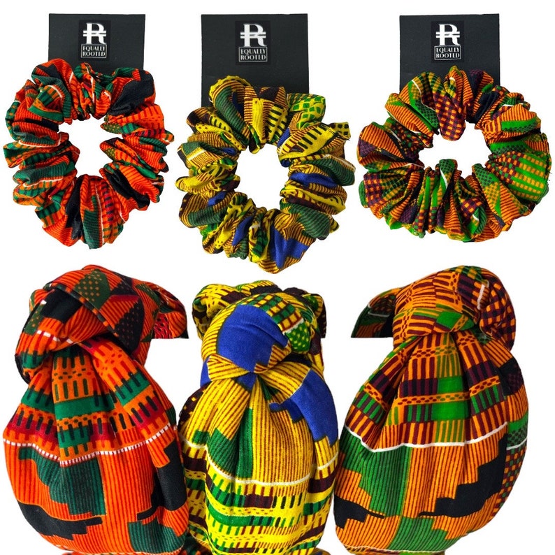 May include: Six colourful scrunchies and head wraps with vibrant African-inspired patterns. The scrunchies and head wraps feature a variety of colours, including orange, green, yellow, and blue. Each item is attached to a black card with the text "Equally Rooted".