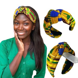 May include: A patterned headband with a knotted design. The headband features a vibrant mix of yellow, blue, green, and red geometric patterns. The image also shows a woman wearing the headband, and two additional headbands.
