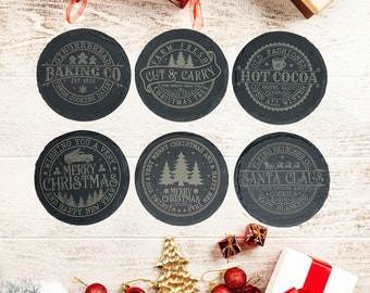 7 Piece Festive Slate Christmas Coasters, Holiday Elegance 4 Inch Round 6 different designs in this set. Metal holder included.