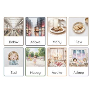 May include: A set of eight illustrated cards with different scenes and words. The cards are in a grid format with two rows and four columns. The top row features a train station, a city street, a plate of cookies, and a plate with a few cookies. The bottom row features a girl with a sad expression, a girl running in a park, a girl waking up in bed, and a girl sleeping in bed with a teddy bear. The words on the cards are "Below", "Above", "Many", "Few", "Sad", "Happy", "Awake", and "Asleep".
