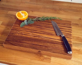 Oak cutting board with crisscross iroko strips inlaid