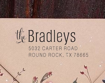 May include: A brown envelope with a floral design and the text "the Bradleys" printed on the front. The address is "5032 Carter Road, Round Rock, TX 78665".