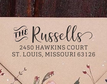 May include: A brown envelope with a floral pattern and a return address label that reads "The Russells, 2450 Hawkins Court, St. Louis, Missouri 63126."