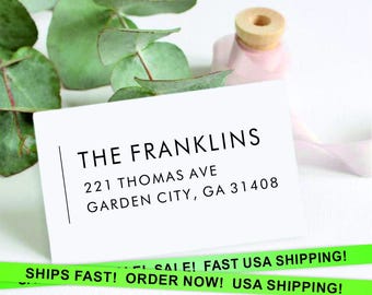 May include: White card with black text that reads "THE FRANKLINS", "221 THOMAS AVE", and "GARDEN CITY, GA 31408".