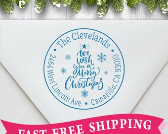 May include: A blue round return address stamp with the text "The Clevelands" and "We wish you a Merry Christmas" with snowflakes and a star. The address is "2464 West Lincoln Ave, Camarillo, CA 93010".