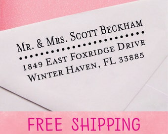May include: White envelope with black text. The text reads "MR. & MRS. SCOTT BECKHAM 1849 EAST FOXRIDGE DRIVE WINTER HAVEN, FL 33885". The bottom of the envelope has the text "FREE SHIPPING" in pink.