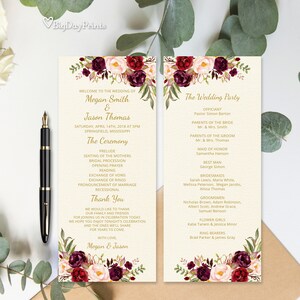 May include: Wedding ceremony program with burgundy and blush floral design. The program includes the order of events, the wedding party, and the officiant's name. The text is in gold lettering.