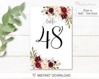 May include: Printable table number card with a floral design in shades of burgundy, pink, and green. The card says "table 48" in black calligraphy.