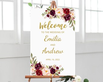 Könnte beinhalten: Willkommensschild mit burgunderrotem und rosafarbenem Blumendesign. Das Schild lautet "Willkommen zur Hochzeit von Emilia und Andrew am 16. April 2022".