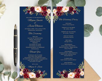 May include: A navy blue wedding program with burgundy and blush floral accents. The program includes the ceremony order, wedding party, and a thank you message from the couple. The text reads "Welcome to the wedding of Megan Smith & Jason Thomas".