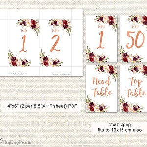 May include: White table number cards with copper-colored numbers and text. Each card features floral arrangements in burgundy, cream, and green. The cards are labeled "Table 1", "Table 2", "Table 50", "Head Table", and "Top Table".