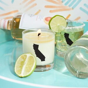 May include: A set of three ceramic mugs with a speckled, matte finish. The mugs are in shades of cream, light gray, and dark gray. Each mug has a simple, minimalist design and a rounded handle.