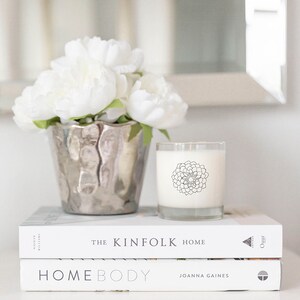 May include: A set of three ceramic vases in varying heights. The vases have a matte finish in shades of cream, beige, and brown. The tallest vase is approximately 10 inches high.