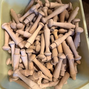 Shaker style solid unfinished wooden pegs…price is for 1 but I have 24 available