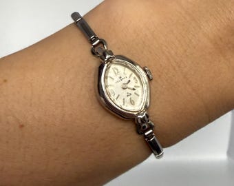 Reloj mecánico Helbros para mujer, de color plateado, estilo vintage de los años 60, FUNCIONANDO.