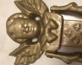 Vintage Cast Iron Angel Cherub with Wings Door Knocker. Old and serene. Origin not specified.
