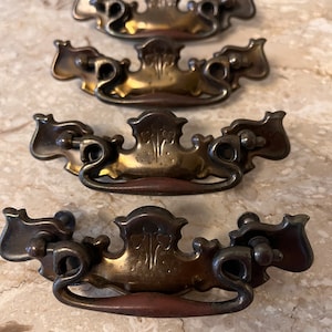 Vintage batwing drawer pulls 3&quot; cast thin backplate with dropdown handle. Chippendale model A4472 DC Set of 4. Excellent condition. Used.