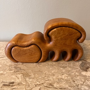 Vintage solid wood maple manual labor hand made jewelry storage case. Slight out compartments. Designer stamp underneath. Smooth, excellent.