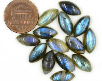 May include: A collection of 12 oval-shaped labradorite gemstones, each with a unique iridescent blue and green sheen. The stones are approximately the size of a US penny.