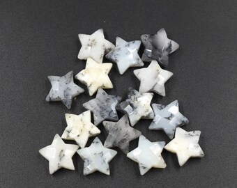 May include: A collection of 15 white and grey star-shaped gemstone beads. The beads are made of opal and have a natural, organic look.