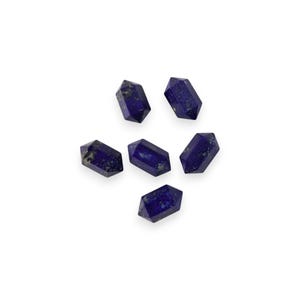 May include: Six dark blue lapis lazuli crystal points, each with a unique shape and pattern of white and gold inclusions.