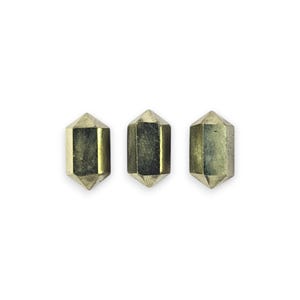 May include: Three gold-colored, faceted, double-terminated crystal points.