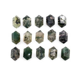 May include: Fifteen green, gray, and white moss agate tumbled stones in the shape of a hexagon.