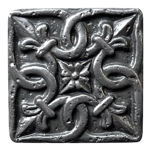 May include: A square pewter tile with a Celtic knot design. The tile is silver in color and has a raised, textured surface.