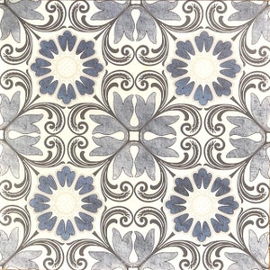 May include: A white tile with a blue and brown floral pattern. The pattern features stylized flowers and leaves.