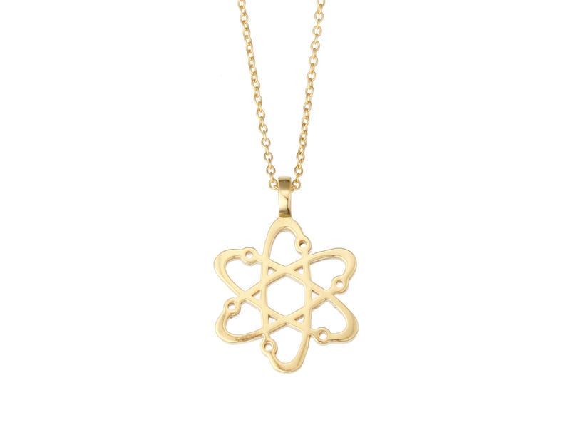 May include: A gold necklace with an atom pendant. The pendant is a delicate, openwork design.