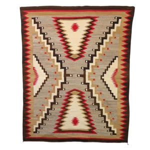 May include: A rectangular woven rug with a geometric pattern. The rug features a central gray field with zigzag and stepped designs in brown, red, tan, and cream. The border is a dark brown.