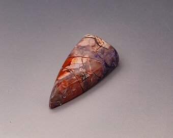Tiffany stone shield shaped cabochon polished both sides natural untreated 31 mm x 15 mm x 8 mm deep. 25.5 carats.