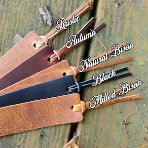 May include: Five leather bookmarks in different colors and finishes, including Rustic, Autumn, Natural Bison, Black, and Milled Bison.
