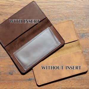 May include: Two brown leather wallets, one with a clear plastic insert labeled "WITH INSERT" and the other without an insert labeled "WITHOUT INSERT".