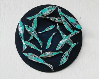 Handmade wooden shoal of fish