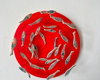 Handmade wooden shoal of fish