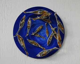 Handmade wooden shoal of fish