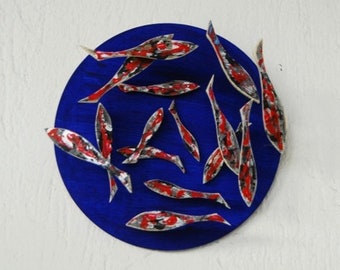 Handmade wooden shoal of fish