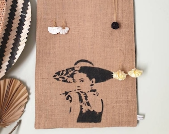 Burlap wall decoration with a lady's head to store hand-painted earrings, jewelry support