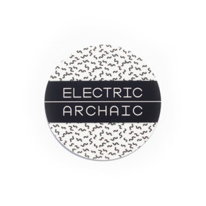May include: A round, white coaster with a black band around the center. The band has the text "ELECTRIC ARCHAIC" in white letters.