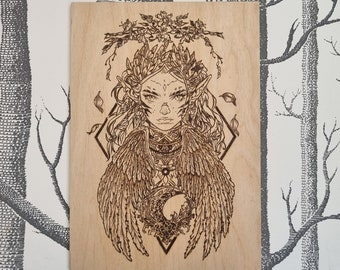 The Raven Queen wood burned art piece.